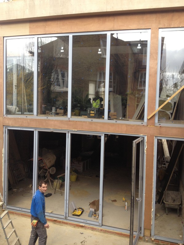 Aluminium bi-fold doors with two-storey glazing in St Paul's