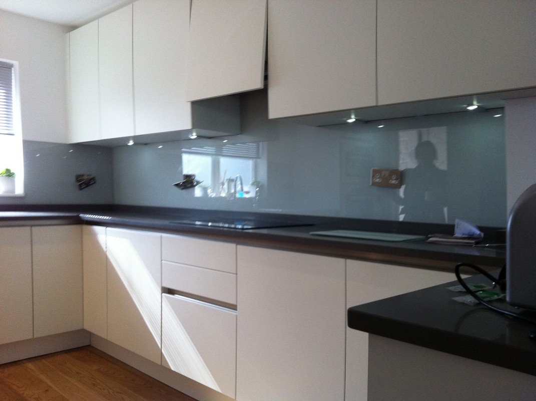 Grey glass kitchen splashback with LED lighting in St Paul's