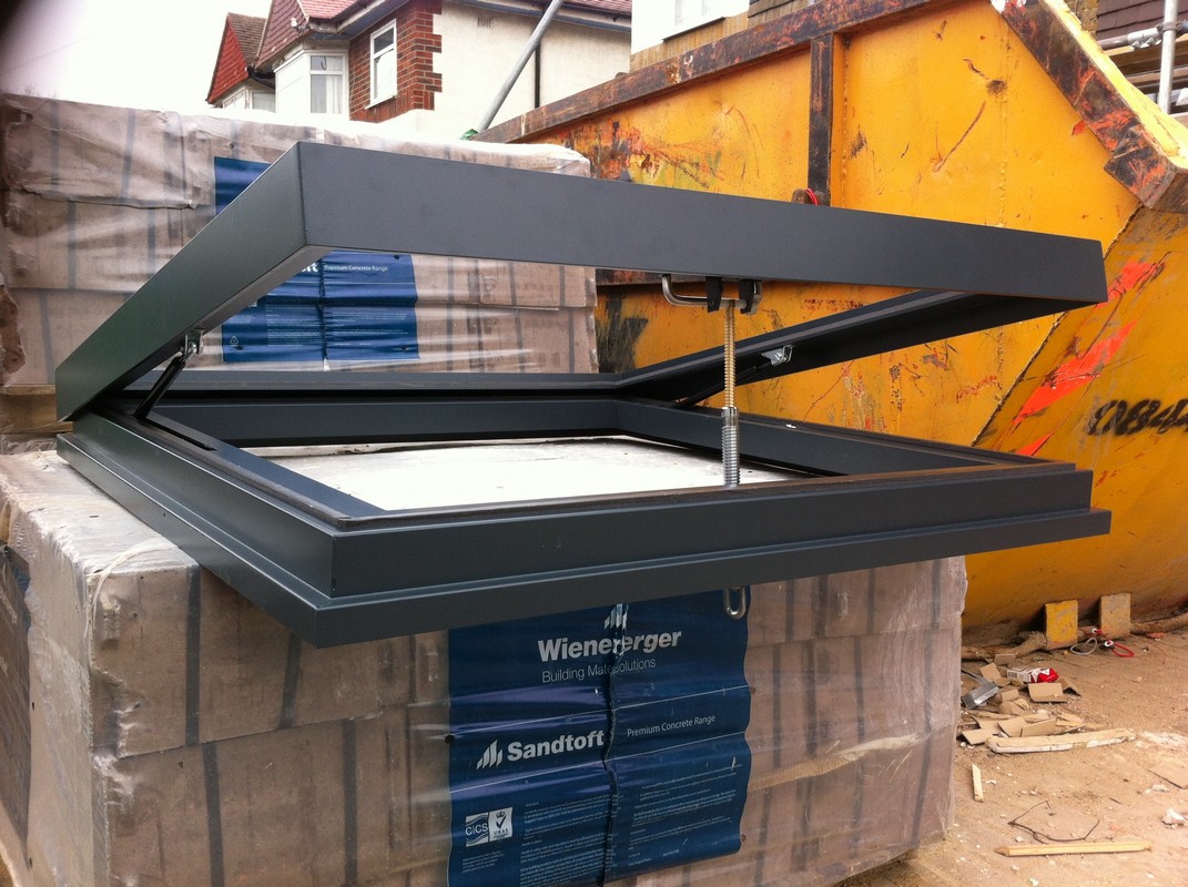 Opening flat roof skylight in anthracite grey installed in St Paul's