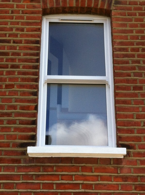 uPVC sash window on Victorian red brick house in St Paul's